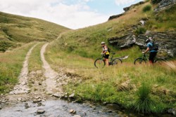 Bernie on her bike leaving a wedding in the hills